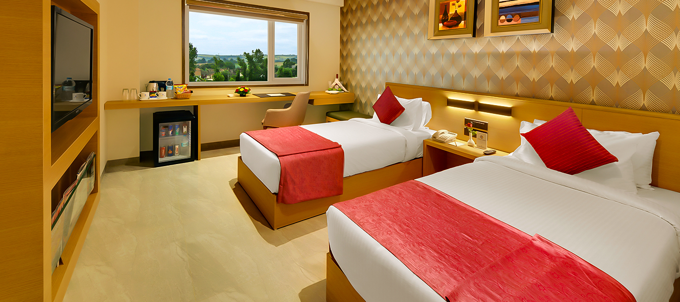 Modern Amenities: Free Wi-Fi, flat-screen TVs, in-room dining, and air conditioning.